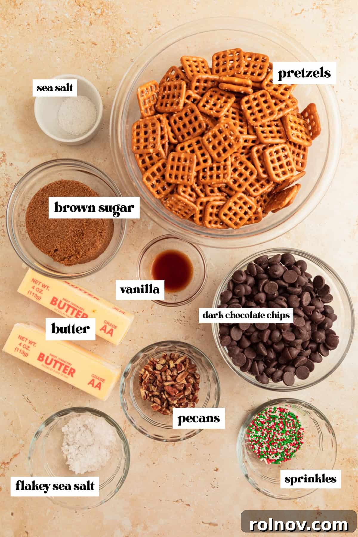 Salty Sweet Pretzel Toffee Crunch 4 A collection of ingredients laid out, including bowls of pretzels, dark chocolate chips, a stick of butter, and other essentials, ready for making pretzel toffee.