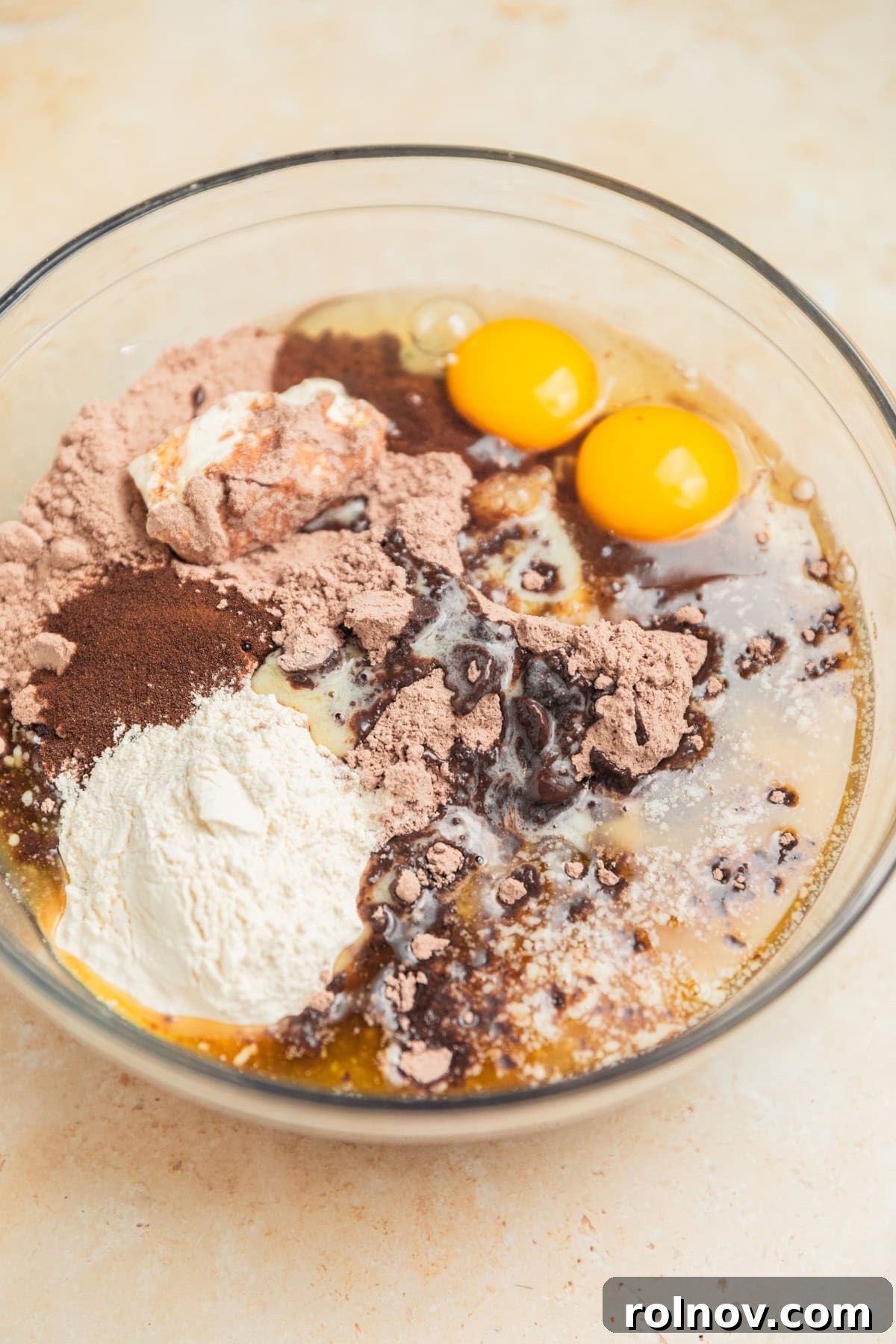 Velvet Chocolate Crinkle Blossoms 4 Brownie mix, eggs, flour, butter and other ingredients in mixing bowl.