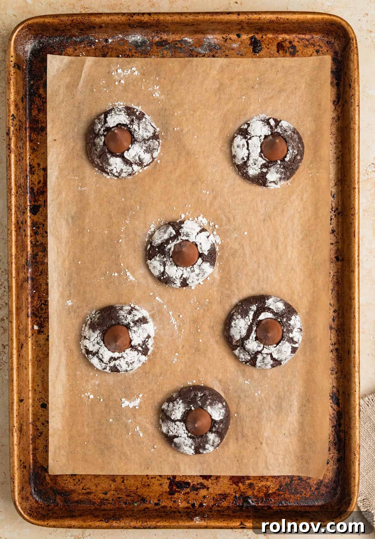 Velvet Chocolate Crinkle Blossoms 9 Chocolate blossom cookies on sheet pan.