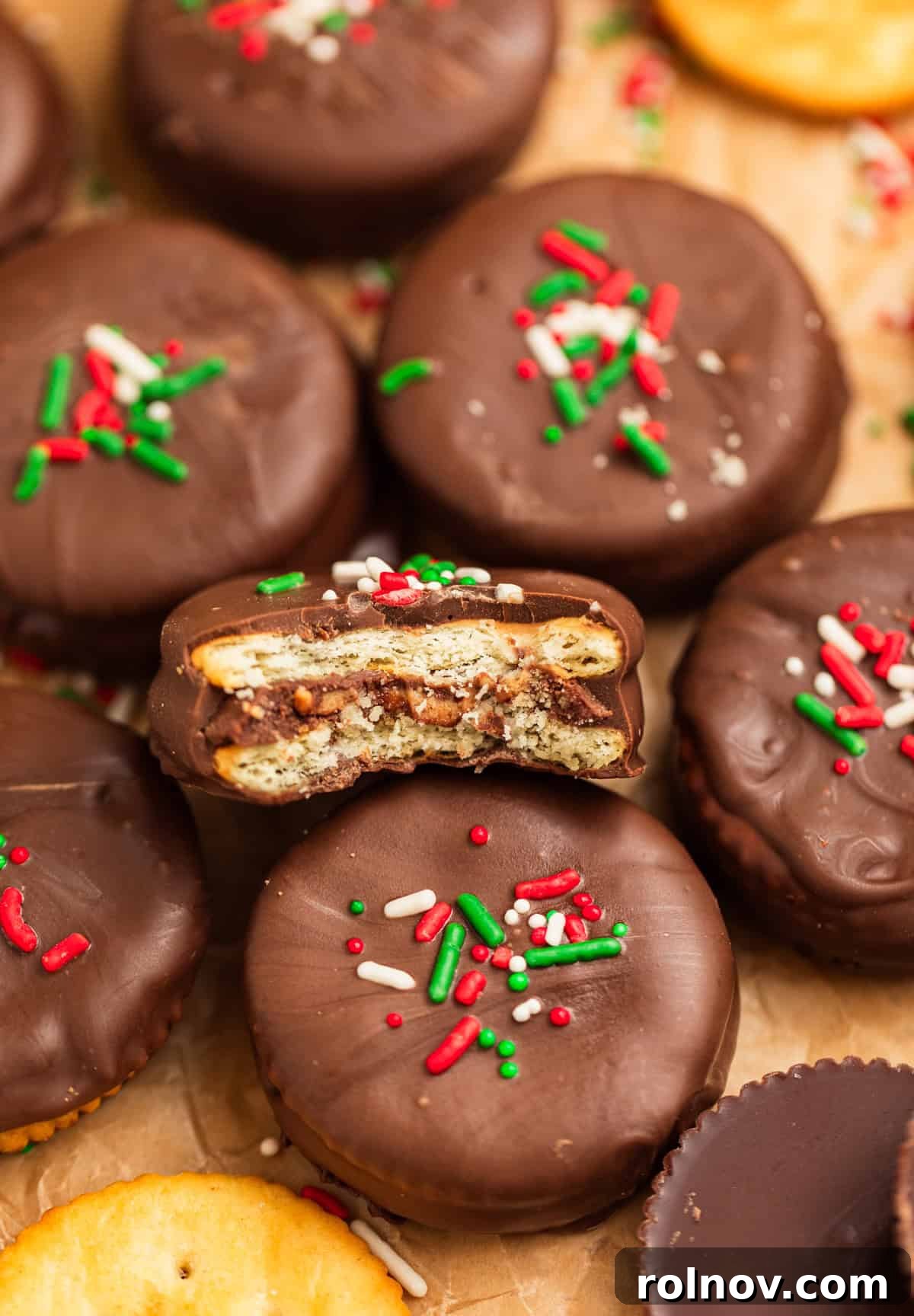 Chocolate dipped ritz cracker cookies with peanut butter cup inside.