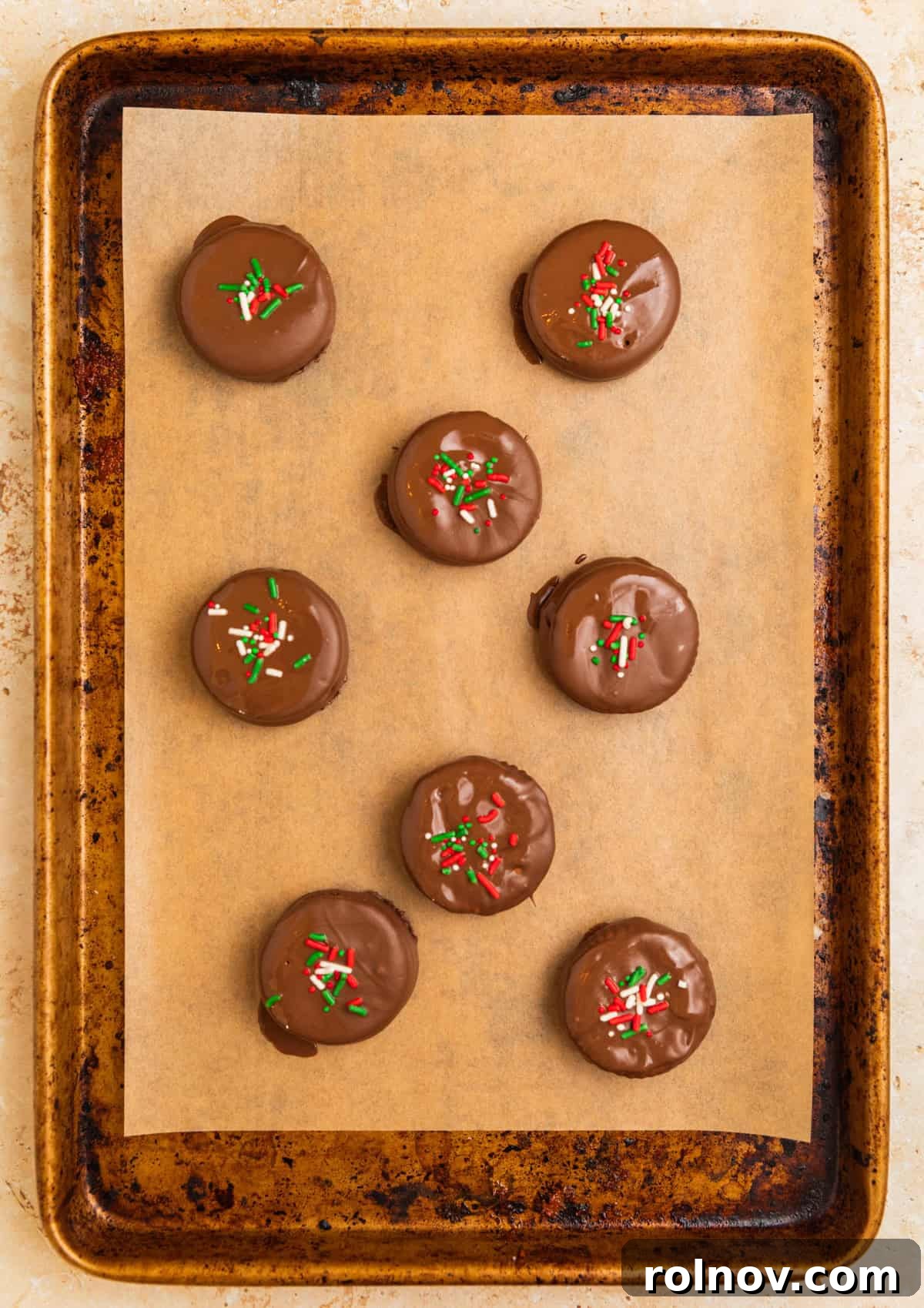 Ritz cracker cookies dipped in chocolate with sprinkles over top.