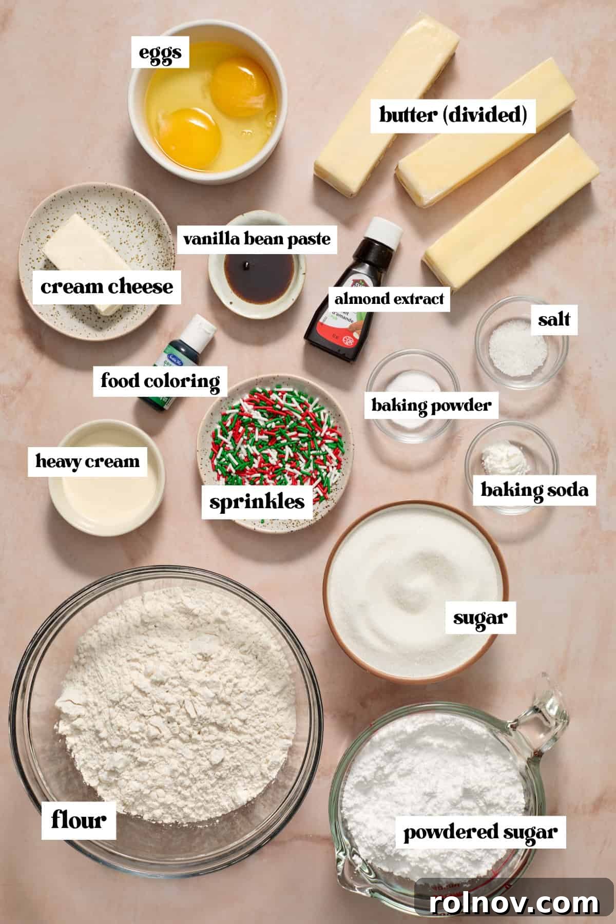 Butter, sugar, flour and other ingredients arranged on surface for making sugar cookie bars.