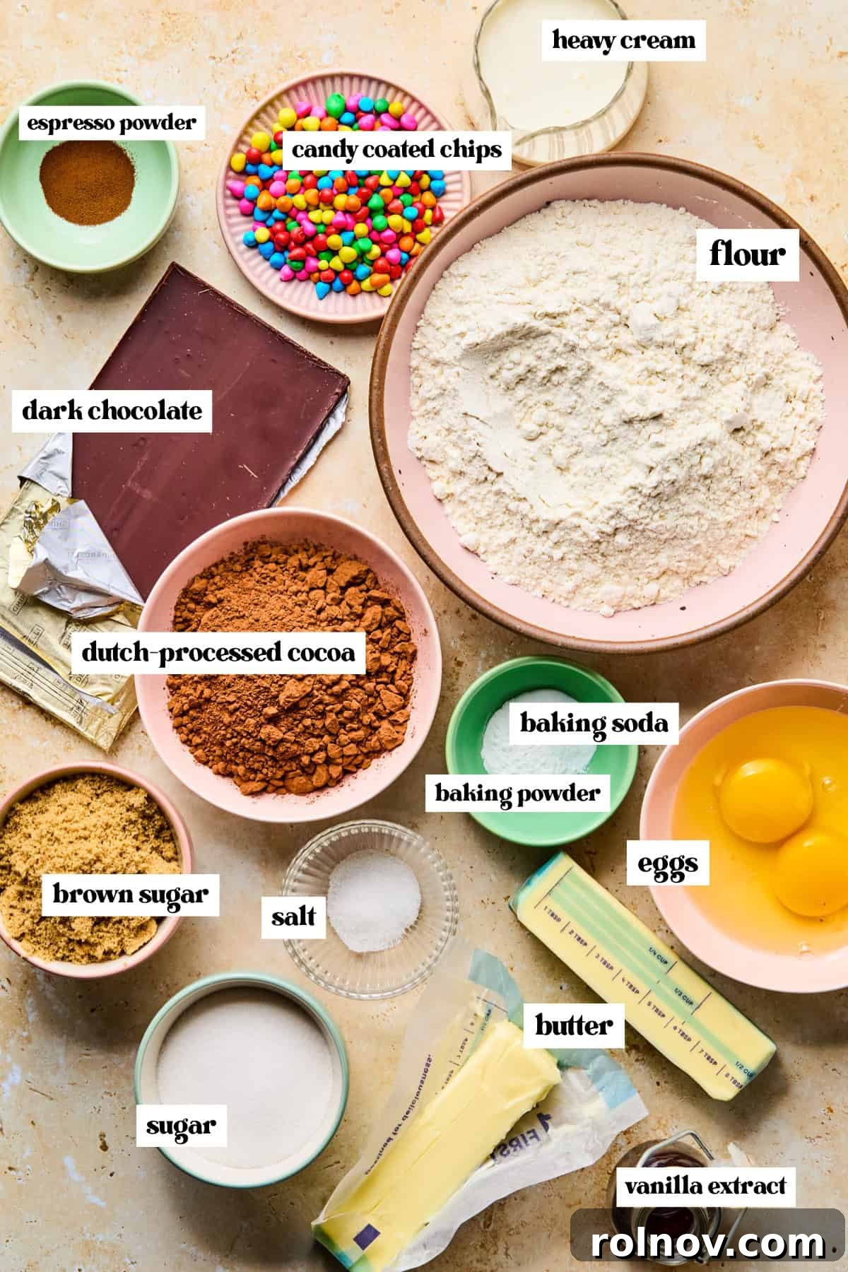 Supernova Brownie Cookies 4 Arrangement of cocoa powder, flour, eggs, and other labeled ingredients, ready for baking.