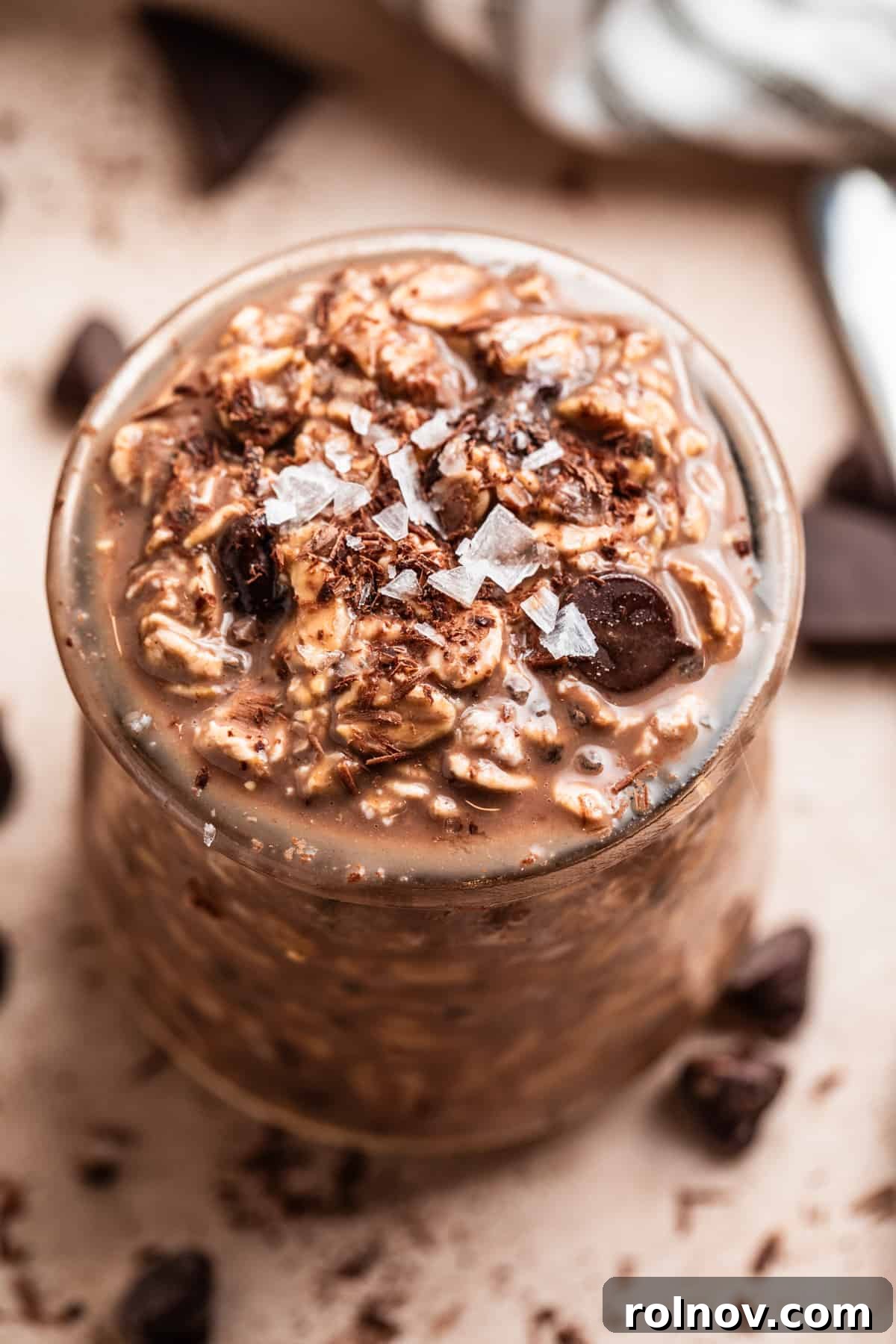 Chocolate oats in jar with salt and chocolate shavings to garnish.