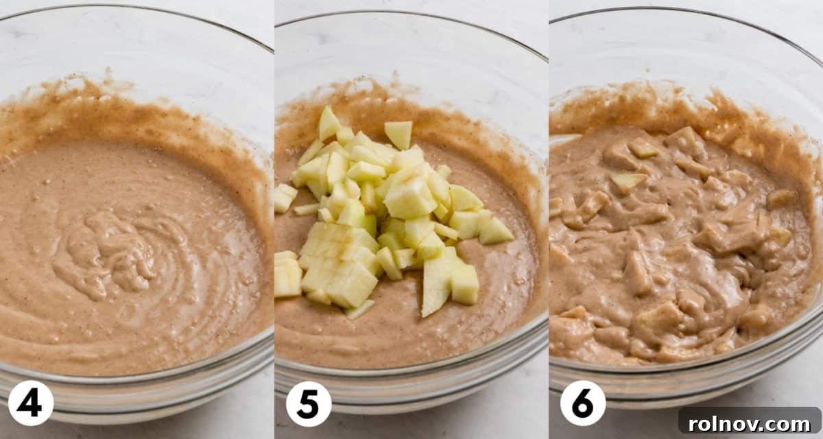 Donut batter in a bowl with diced apple pieces visible, ready to be transferred to a donut pan.