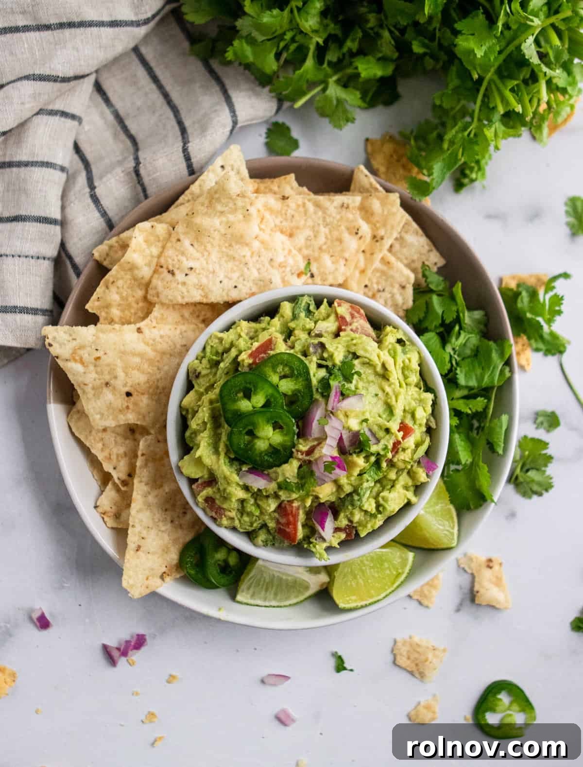 Wholesome Guacamole Made Easy 5 Guacamole with chips and fixins.