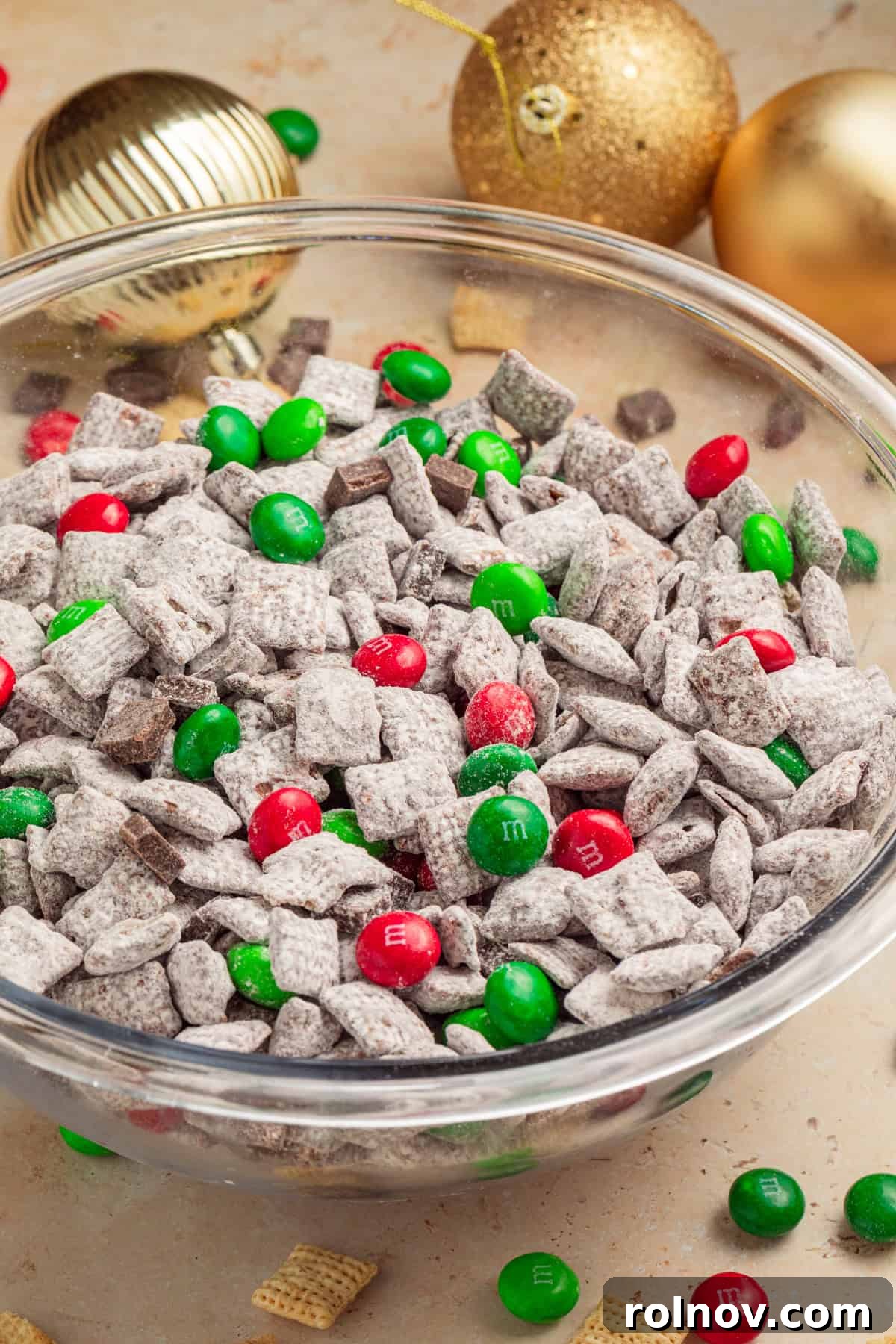 Reindeer Chow Delight 2 A bowl of festive Mint Chocolate Christmas Puppy Chow, adorned with red and green candies, perfect for holiday gatherings.