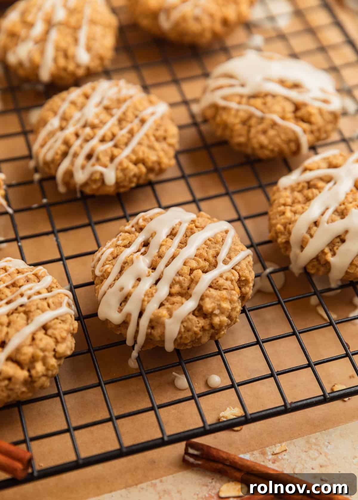 Morning Cinnamon Swirl Cookies 12 Cooled oatmeal cookies arranged on a wire rack, freshly drizzled with sweet white icing.
