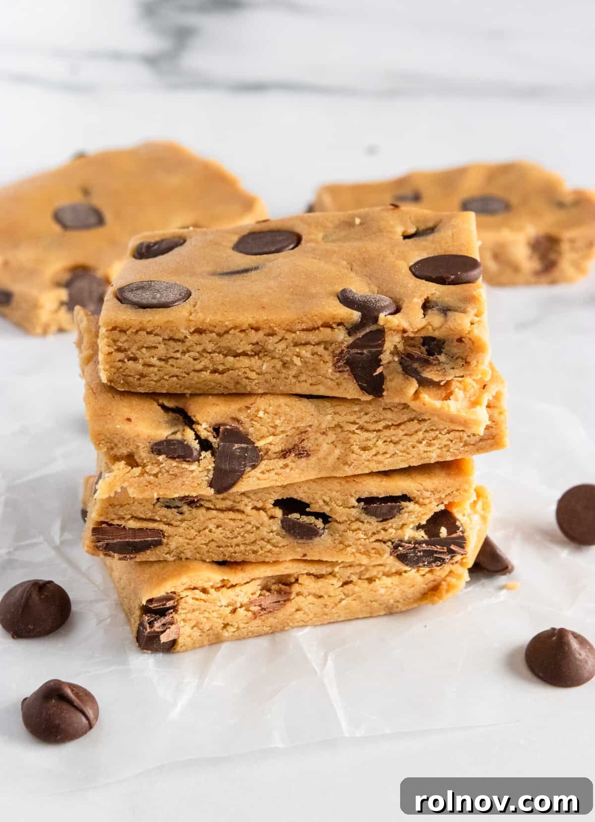 A stack of perfectly crafted homemade peanut butter chocolate chip protein bars, ready for a healthy snack.