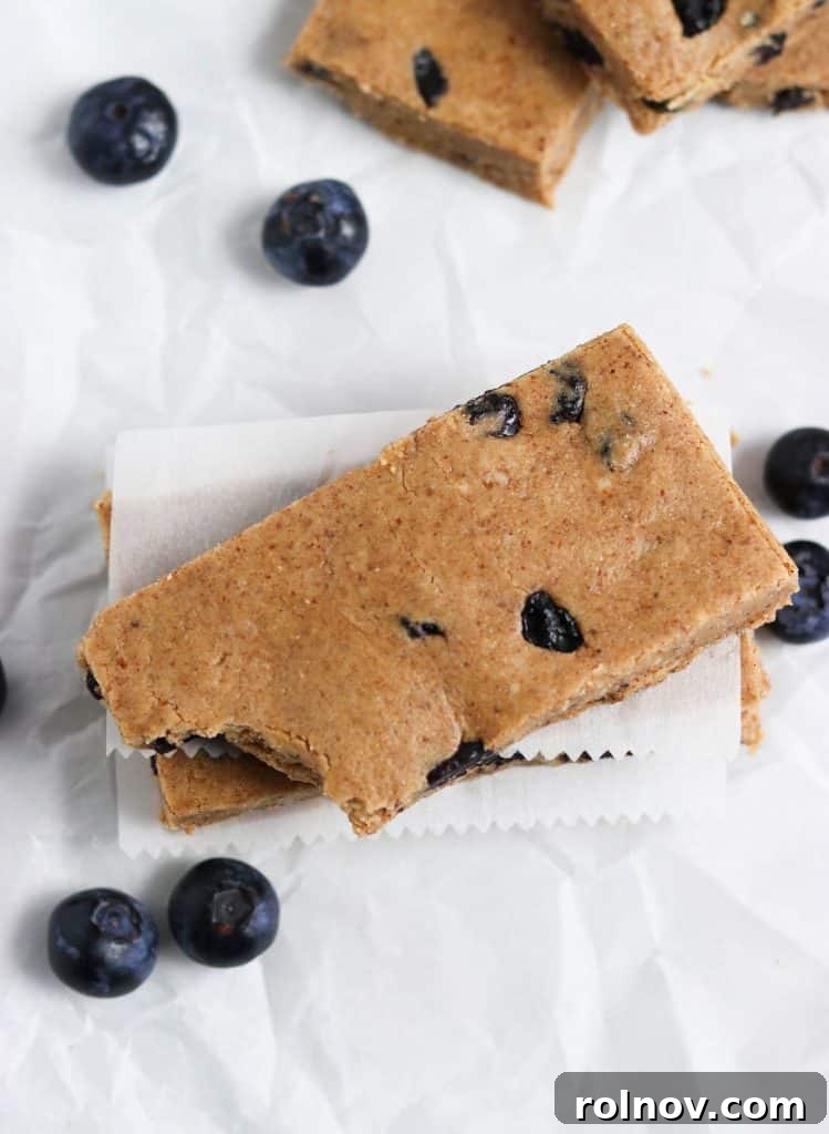 Wholesome Blueberry Muffin Power Bars 4 Side view of No Bake Blueberry Muffin Protein Bars stacked, ready to eat.