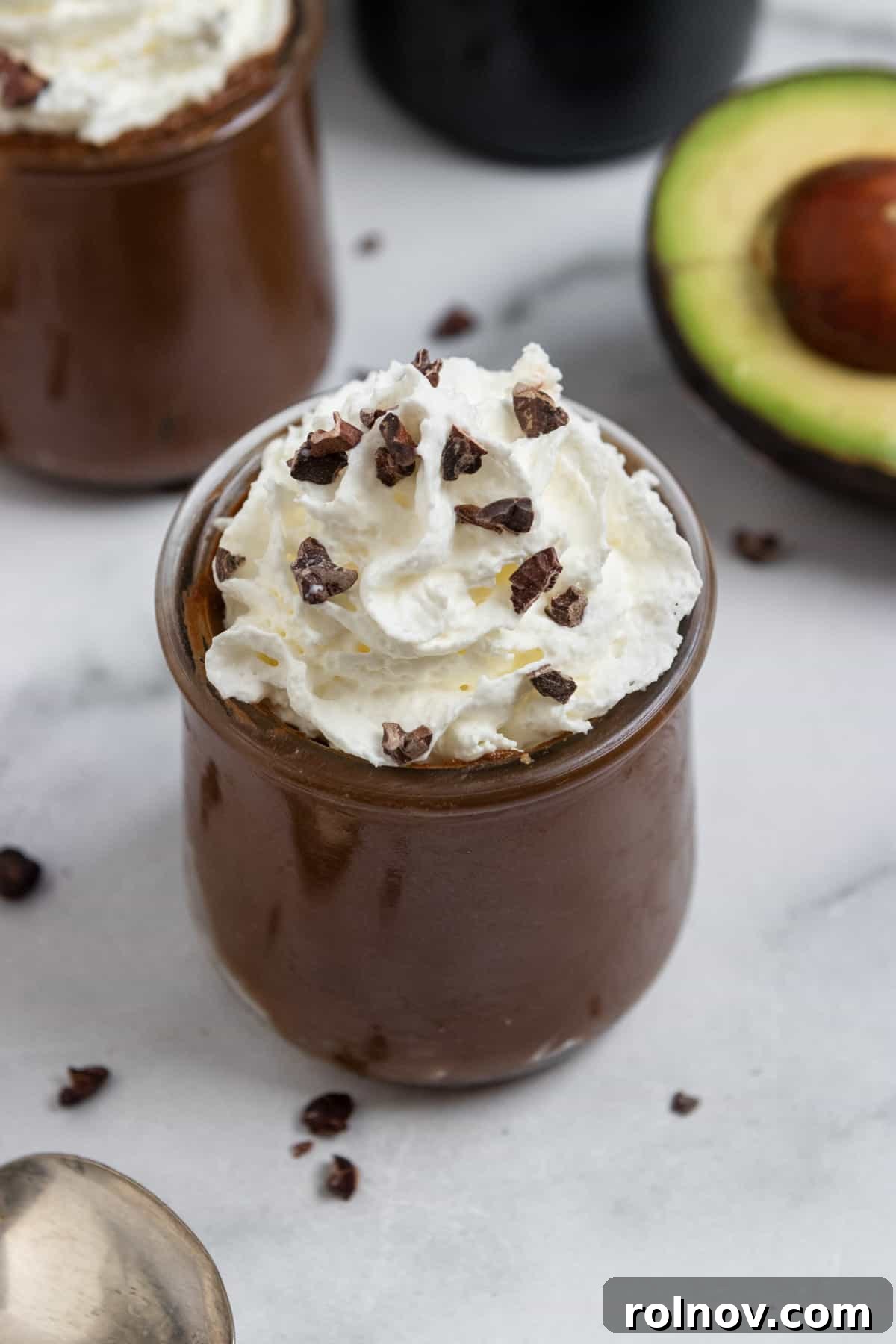 Bailey's Velvet Chocolate Avocado Cloud 3 Bailey's Mousse with whipped cream and avocado in background.