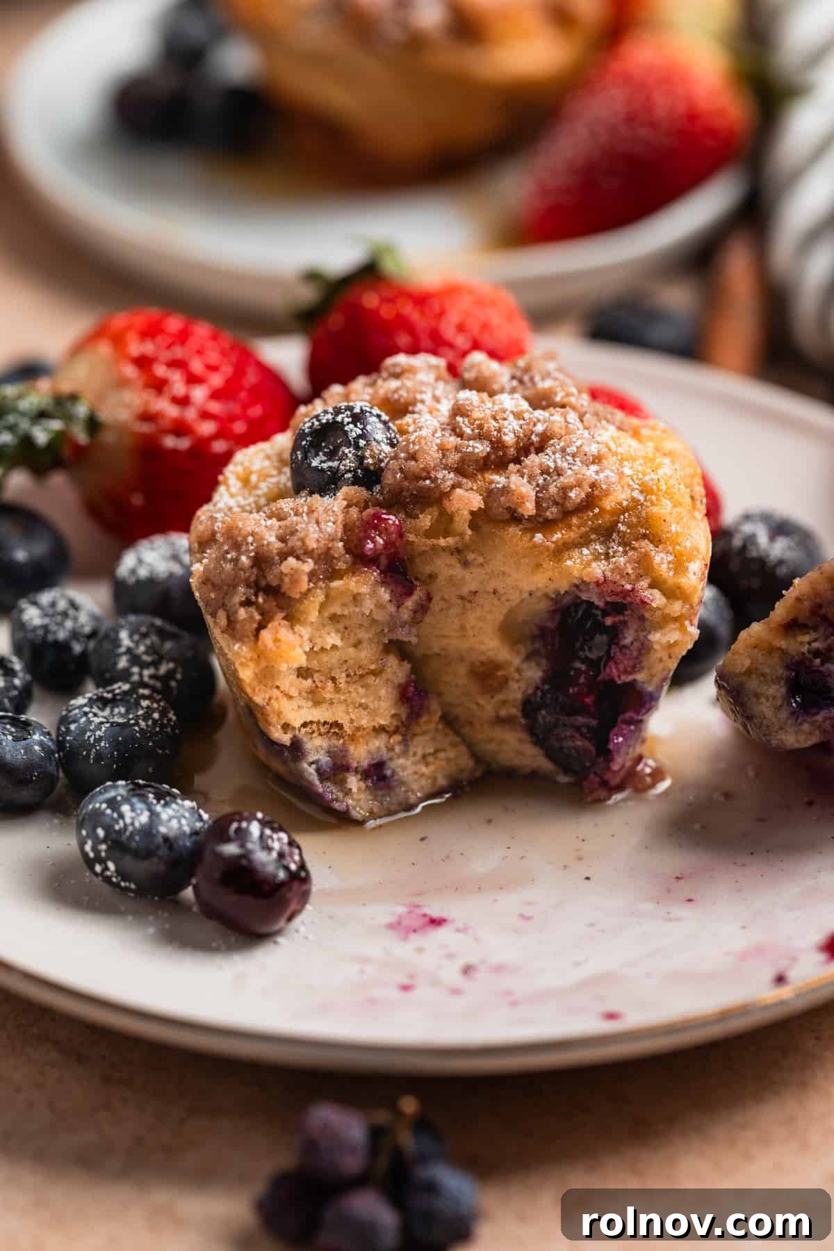 Golden French Toast Bites 11 Blueberry French toast muffin with fork.