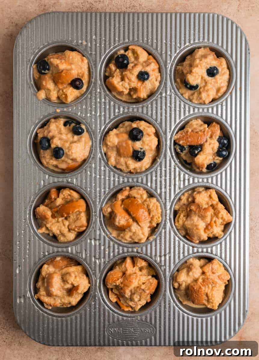 Golden French Toast Bites 8 Muffin tin with French toast muffin mixture and blueberry French toast muffin mixture.