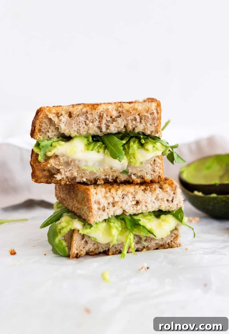 Decadent Havarti Grilled Cheese with Creamy Avocado and Peppery Arugula 2 Gooey Havarti Grilled Cheese with Avocado and Baby Arugula, ready to be enjoyed.