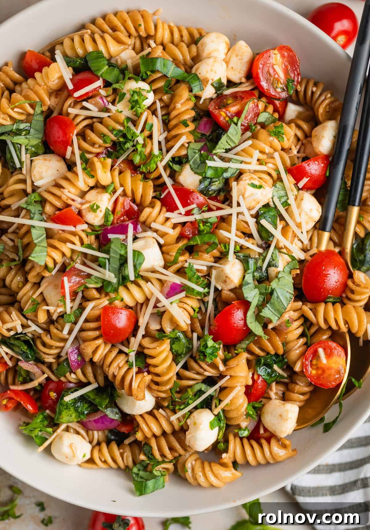 Sun-Kissed Tomato Basil Pasta Salad 11 Overhead view of serving dish with rotini pasta salad.
