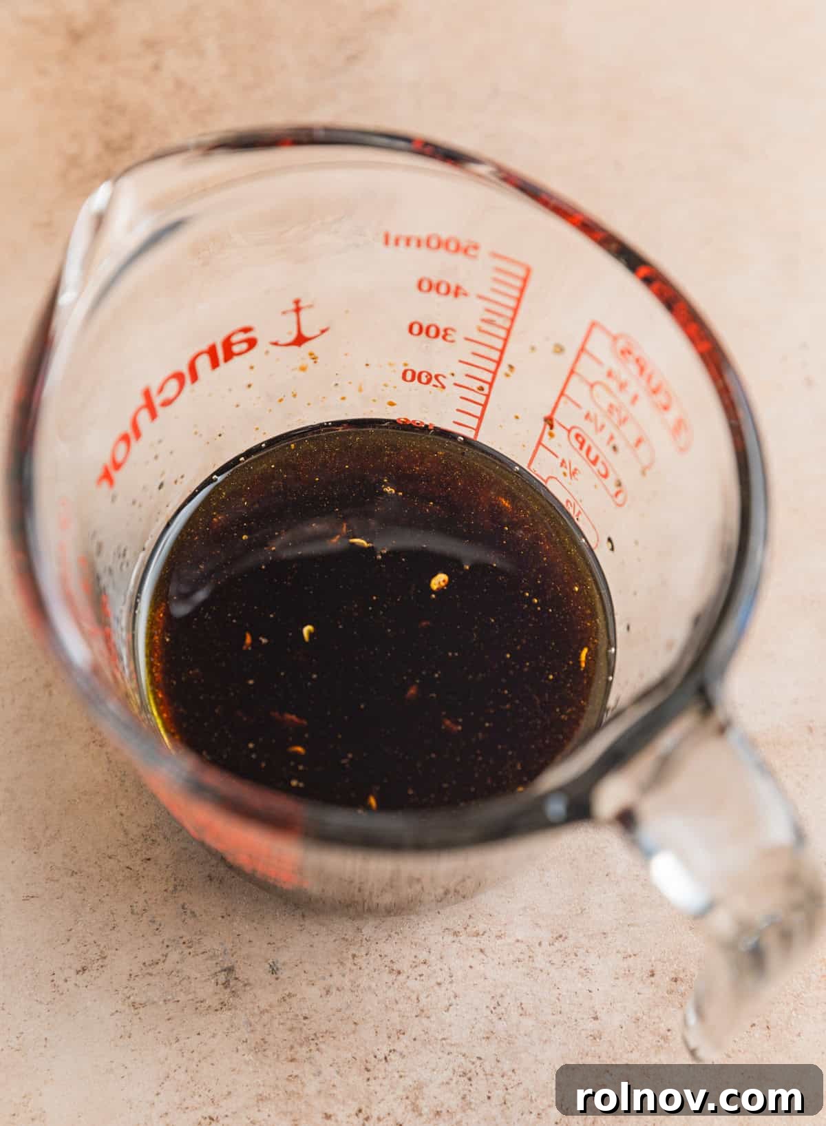 Sun-Kissed Tomato Basil Pasta Salad 7 Olive oil, balsamic vinegar, garlic, salt and pepper mixed in measuring cup.