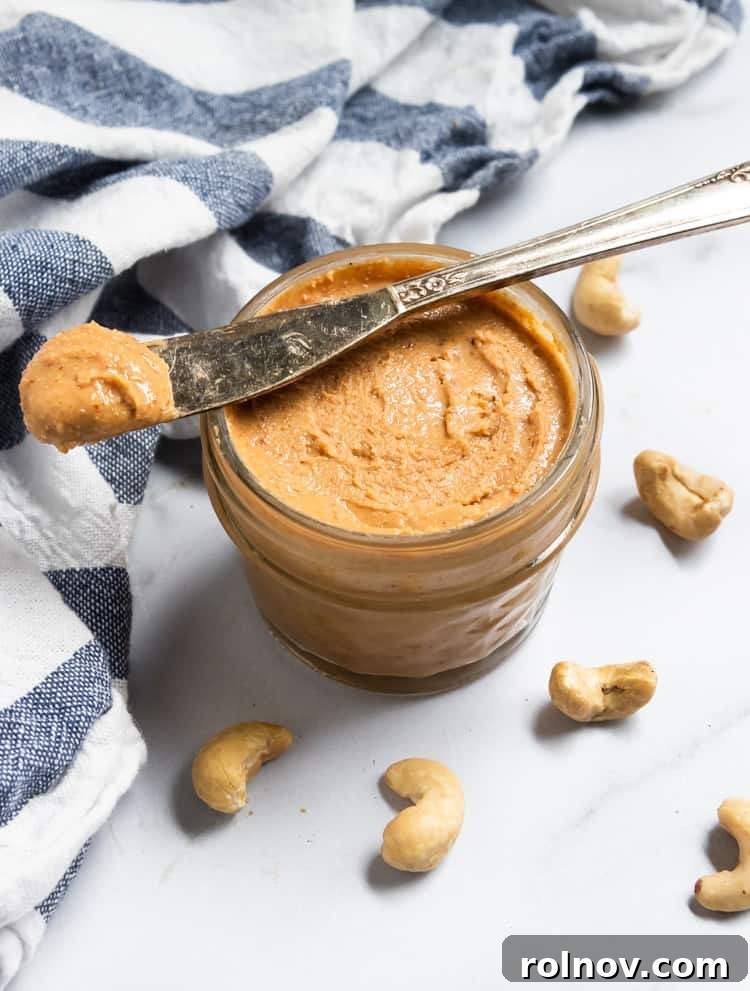 Silky Smooth Maple Vanilla Cashew Butter 2 Delicious homemade Maple Vanilla Cashew Butter in a jar, ready to be enjoyed with a spoon.