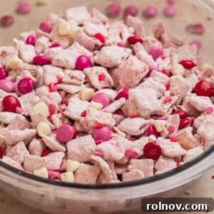 Sweet Strawberry Crunch 14 Glass bowl with strawberry puppy chow snack.