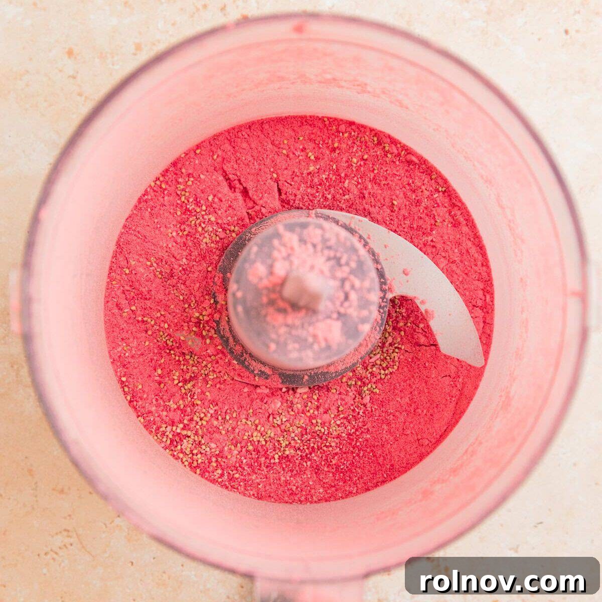 Sweet Strawberry Crunch 5 Freeze-dried strawberries being processed into a fine powder in a food processor.