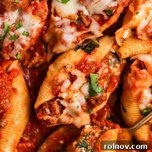 Generously stuffed shells baked in marinara sauce with ground beef, cheese, and fresh chopped basil on top.