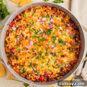 Cheesy taco and rice skillet dinner in pan.
