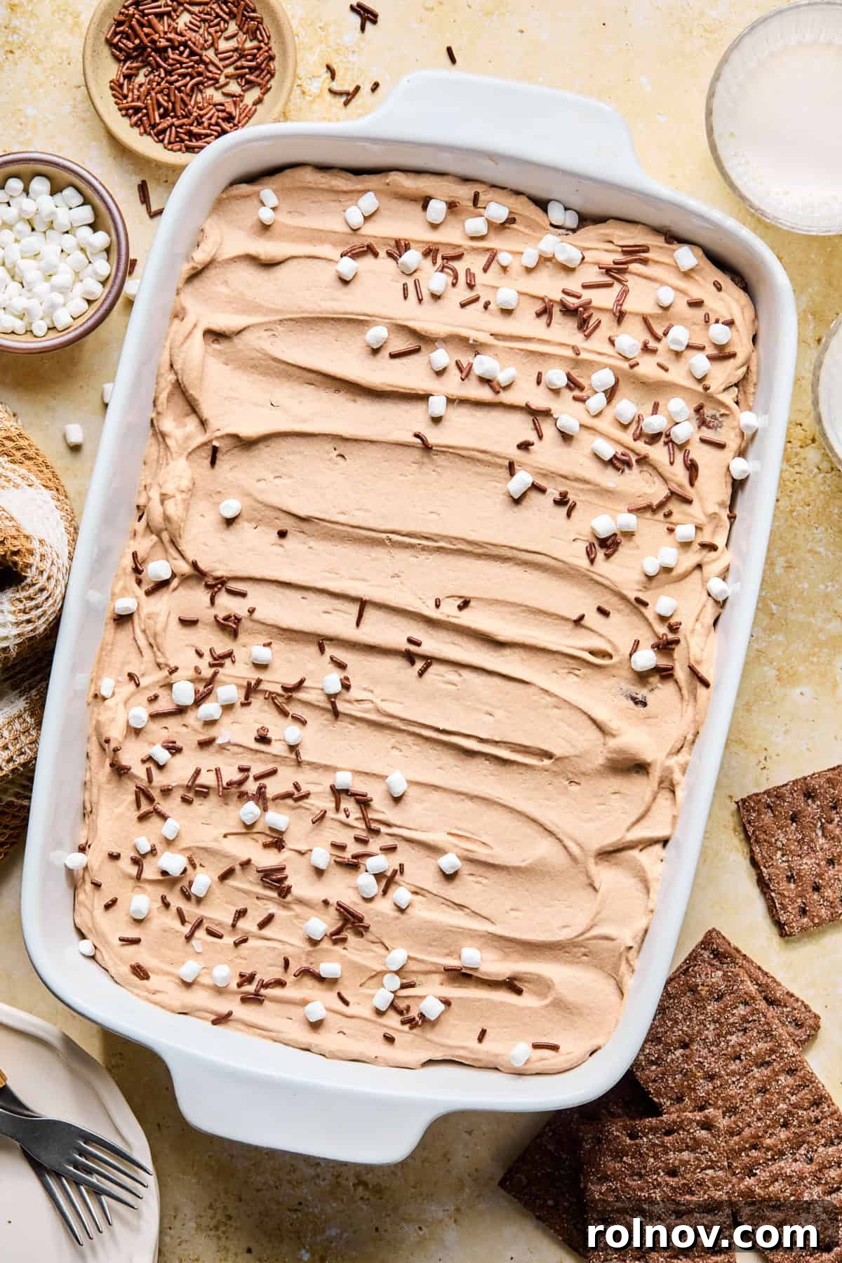 Decadent No-Bake Chocolate Cake 17 The fully garnished Hot Cocoa Icebox Cake, topped generously with mini marshmallows and chocolate sprinkles, ready to be served.