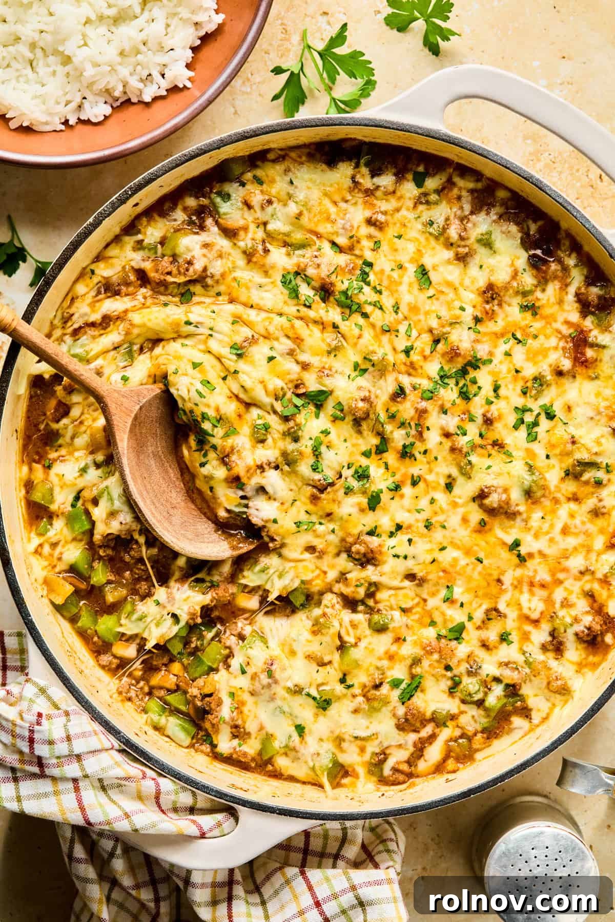 Philly Steak & Cheese Power Bowls 2 Philly cheesesteak bowls in skillet topped with cheese.