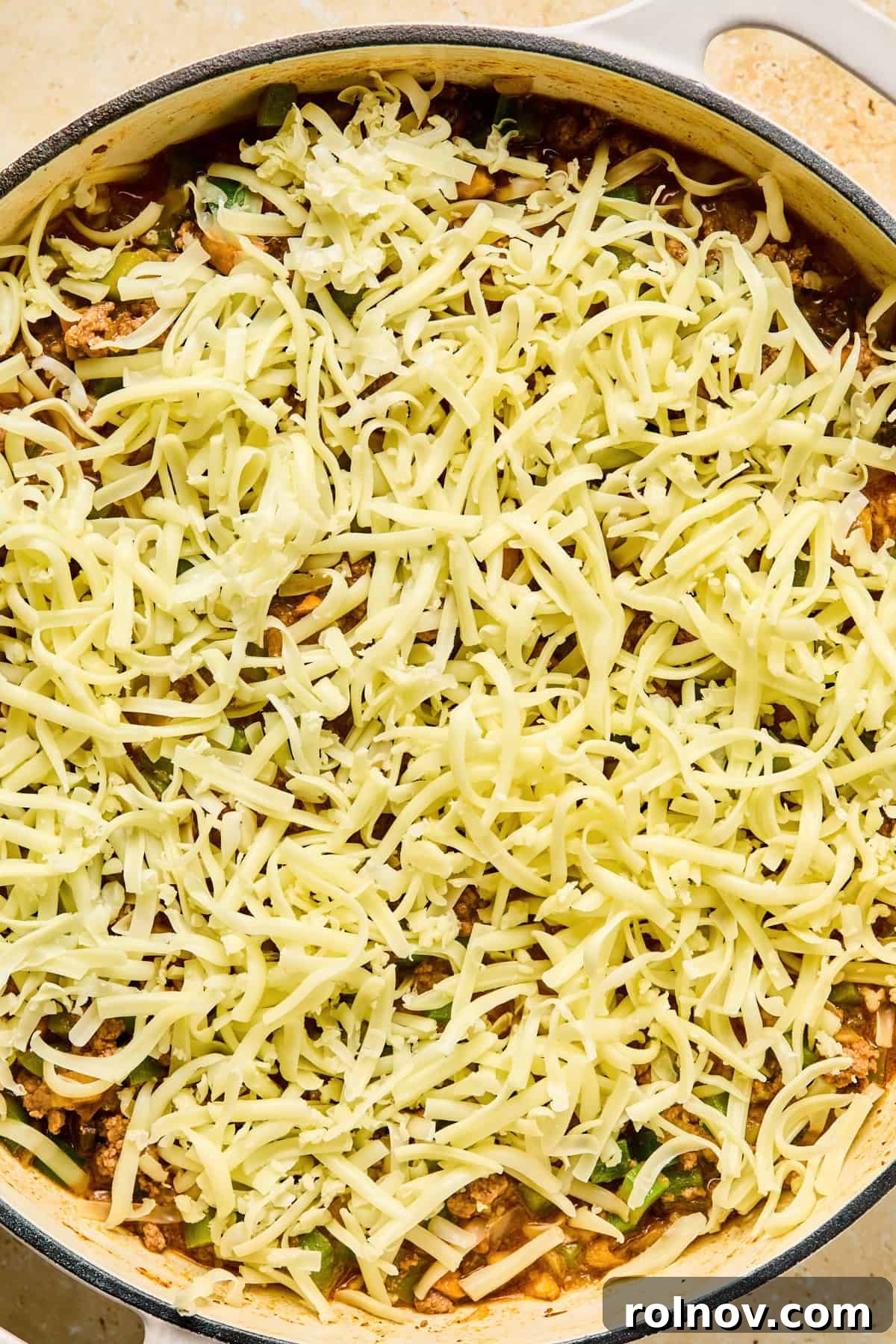 Philly Steak & Cheese Power Bowls 11 Shredded mozzarella cheese covering top of Philly cheesesteak skillet.
