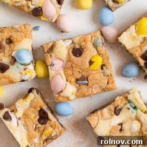 Festive Easter mini egg bars thoughtfully arranged on a counter, surrounded by scattered Cadbury mini eggs for decoration.