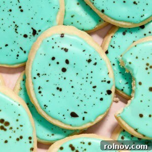 Beautifully iced shortbread cookies, speckled like robin's eggs, creating a charming and festive treat.