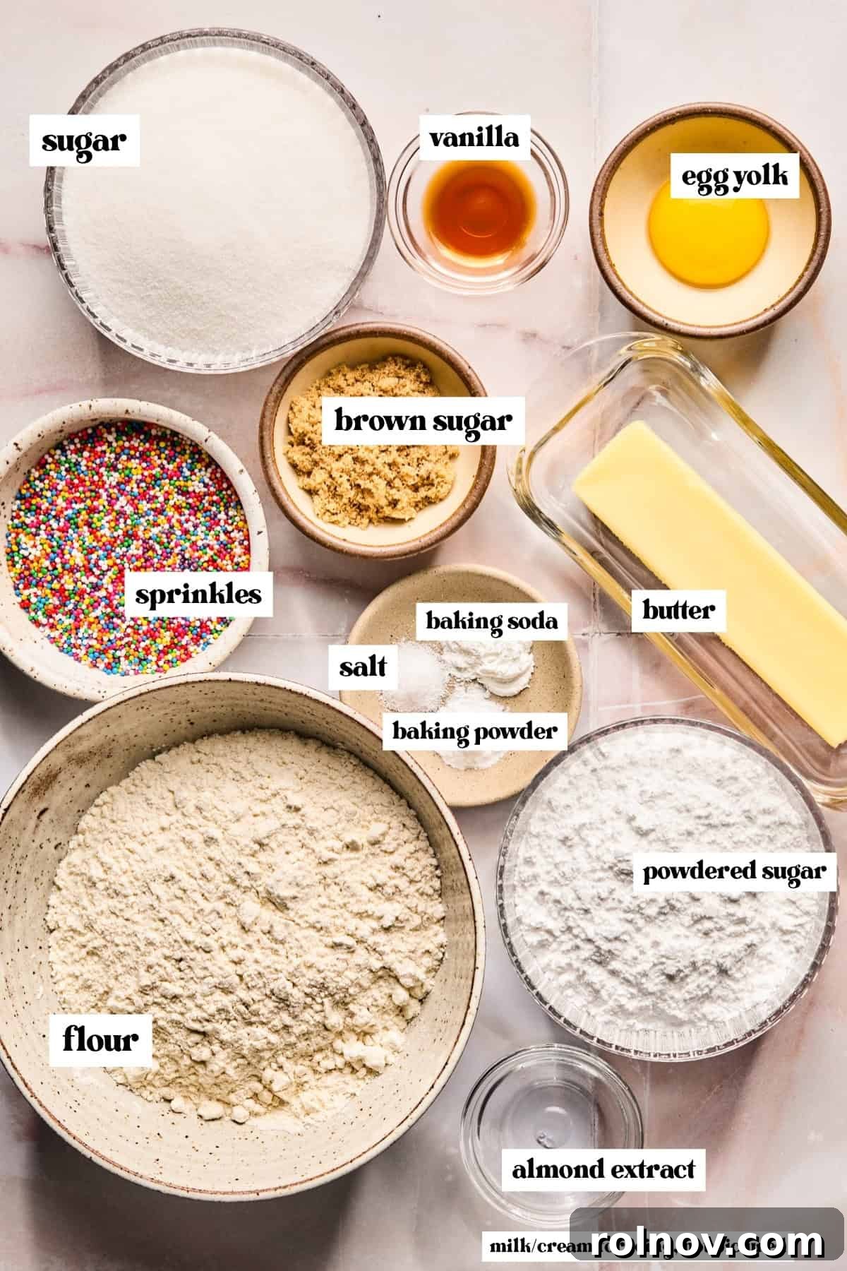 Frosted Sugar Delights 4 Arrangement of essential cookie ingredients including flour, sugar, butter, and eggs.
