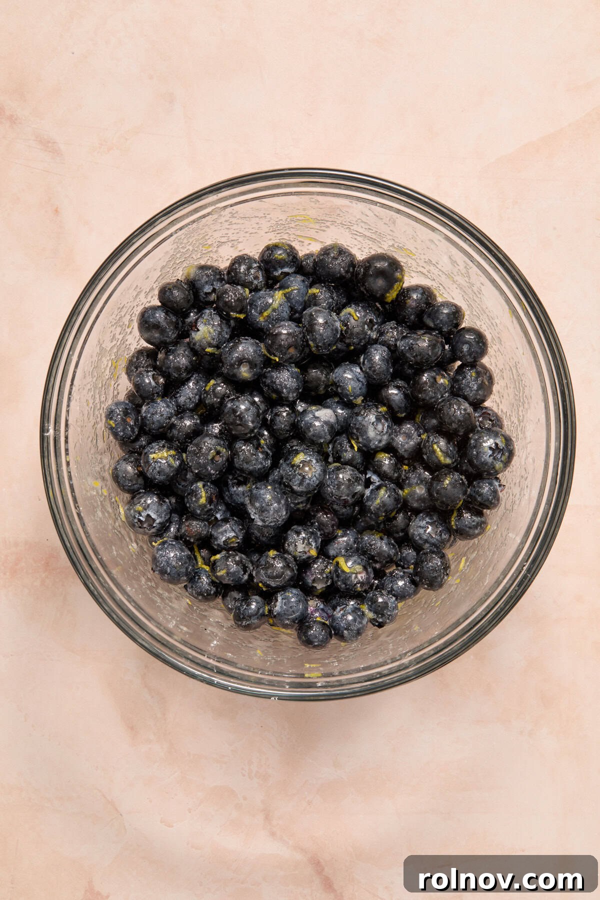 Bright Blueberry Lemon Squares 5 A bowl filled with fresh blueberries, sugar, lemon juice, lemon zest, and cornstarch, mixed together.