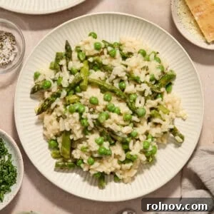 Plate with risotto with spring peas and asparagus.