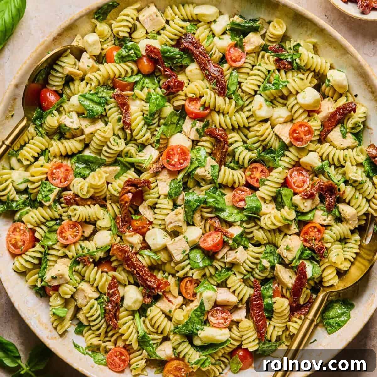 Creamy Pesto Chicken Pasta Salad Recipe for Summer Meals 10 Chicken pesto pasta salad prepared in bowl.