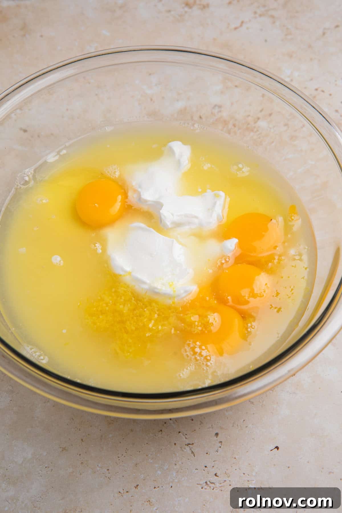 Creamy Lemon Bars with Graham Cracker Crust Recipe 9 Eggs and egg yolks, sour cream, lemon juice, condensed milk and other ingredients in large bowl.