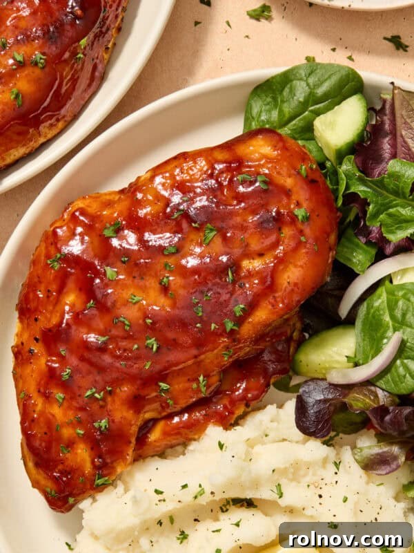 Sticky Honey Mustard Chicken Drumsticks Recipe 14 Air fryer barbecue chicken breast on plate with sides.