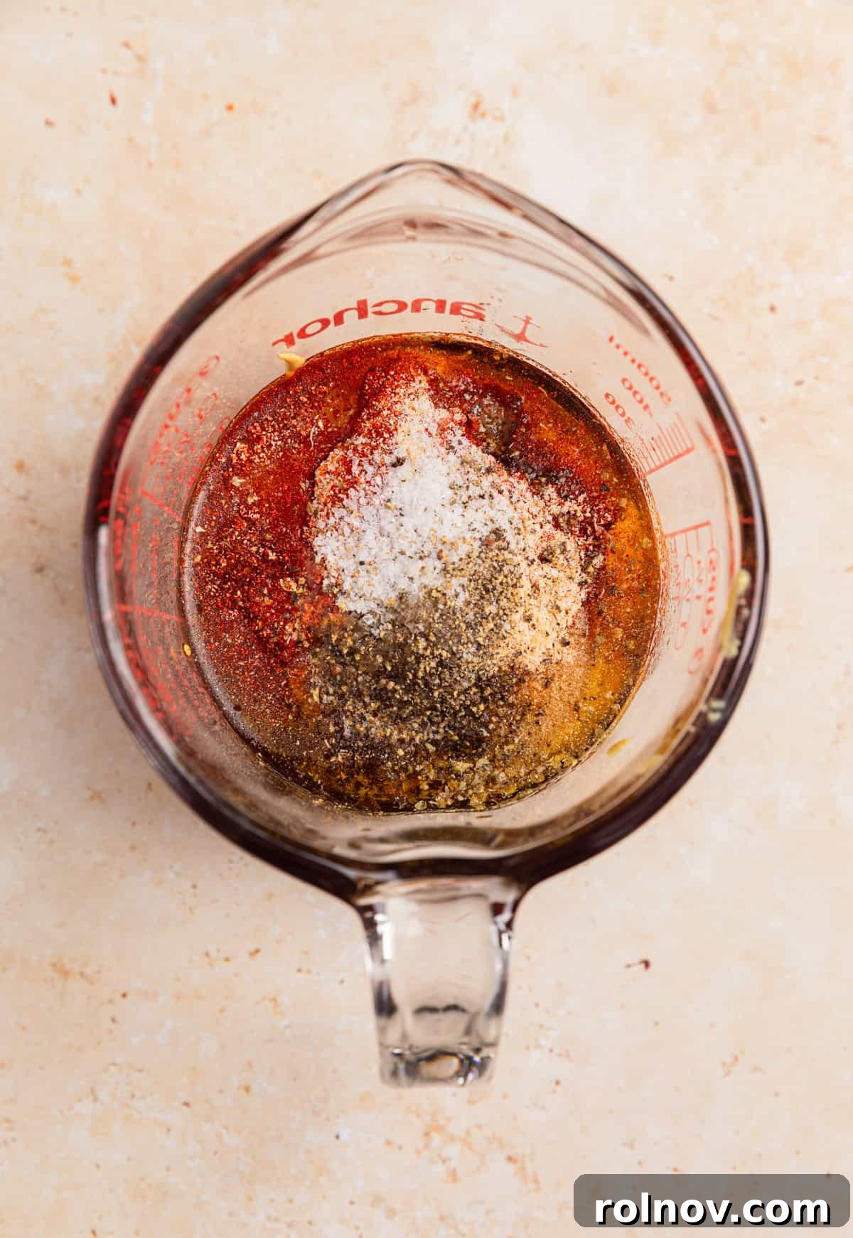 Sticky Honey Mustard Chicken Drumsticks Recipe 5 Ingredients in measuring cup to make honey mustard marinade.