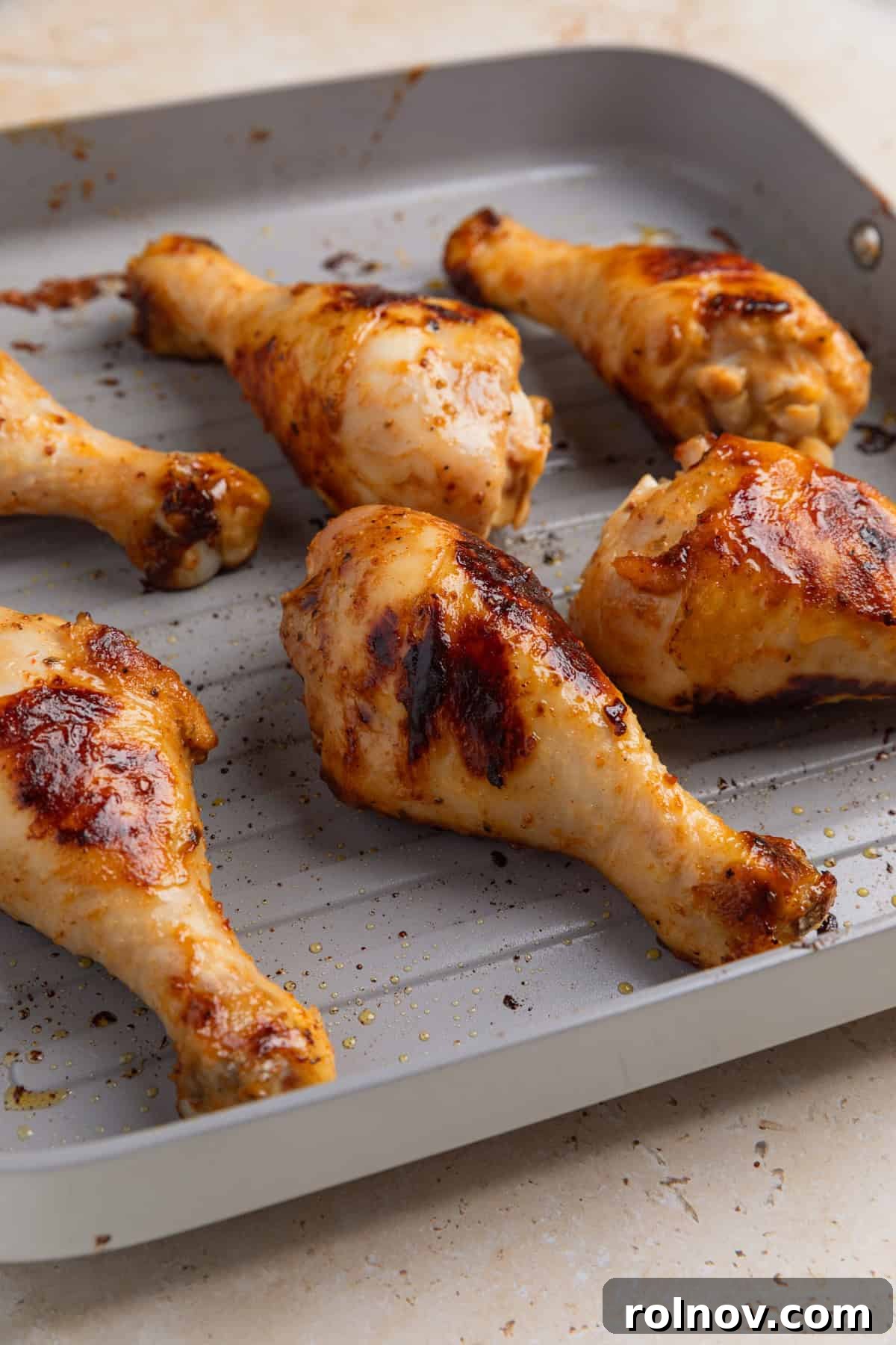 Sticky Honey Mustard Chicken Drumsticks Recipe 9 Chicken drumsticks on grill pan.