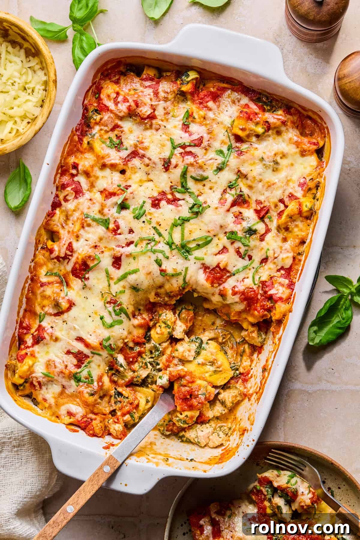 Spinach and Ricotta Tortellini Bake Recipe for Weeknight Dinner 2 Casserole dish with baked spinach ricotta tortellini.