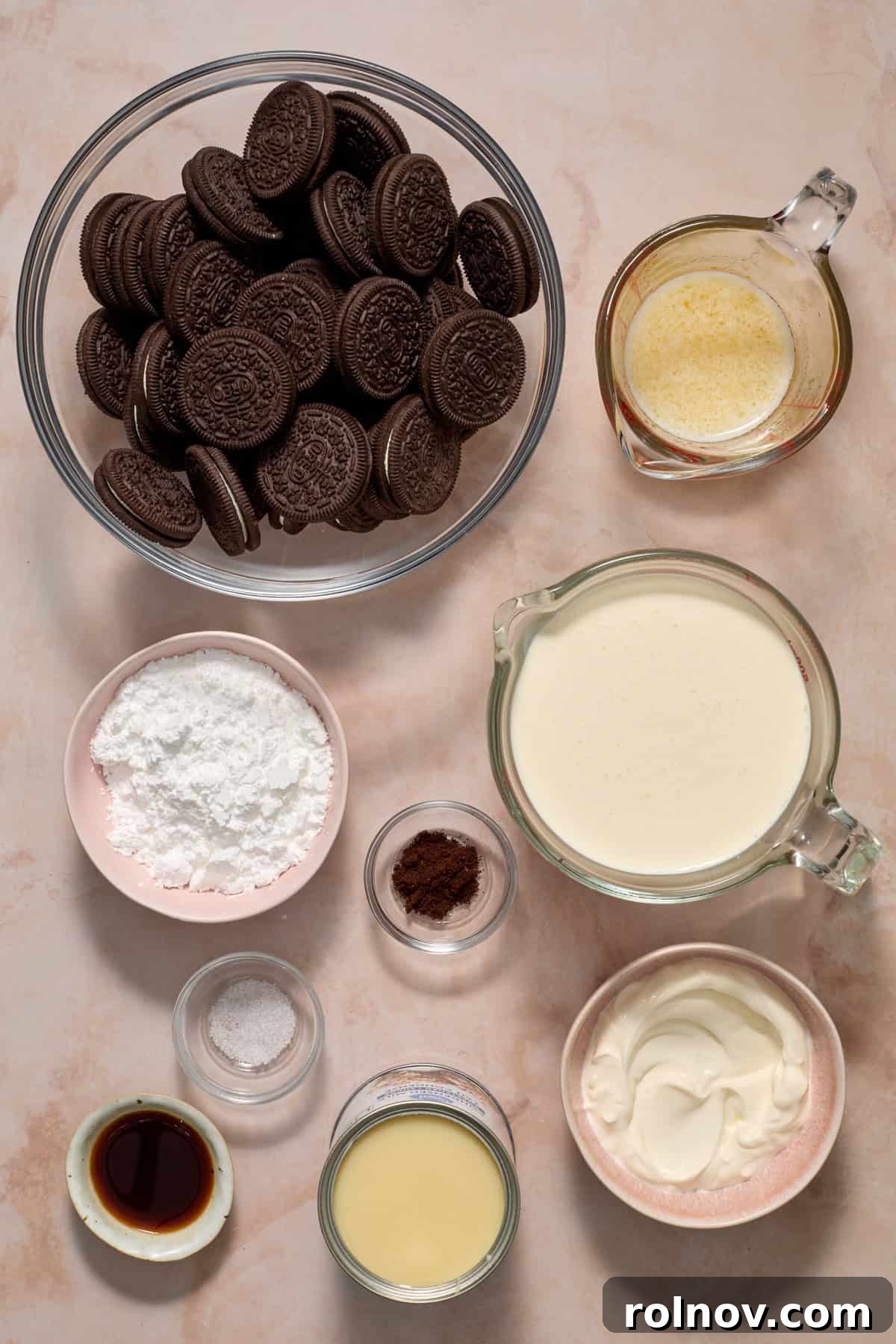 Oreo Ice Cream Pie Recipe: No-Bake Cookies and Cream Dessert 4 Cookies, powdered sugar, butter, cream and other ingredients on surface.