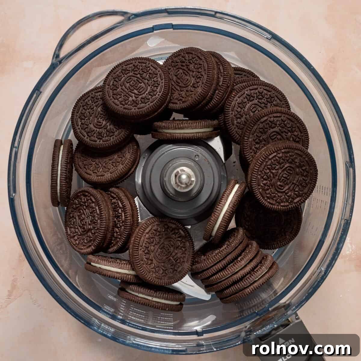 Oreo Ice Cream Pie Recipe: No-Bake Cookies and Cream Dessert 5 Oreo cookies in food processor before being crushed.