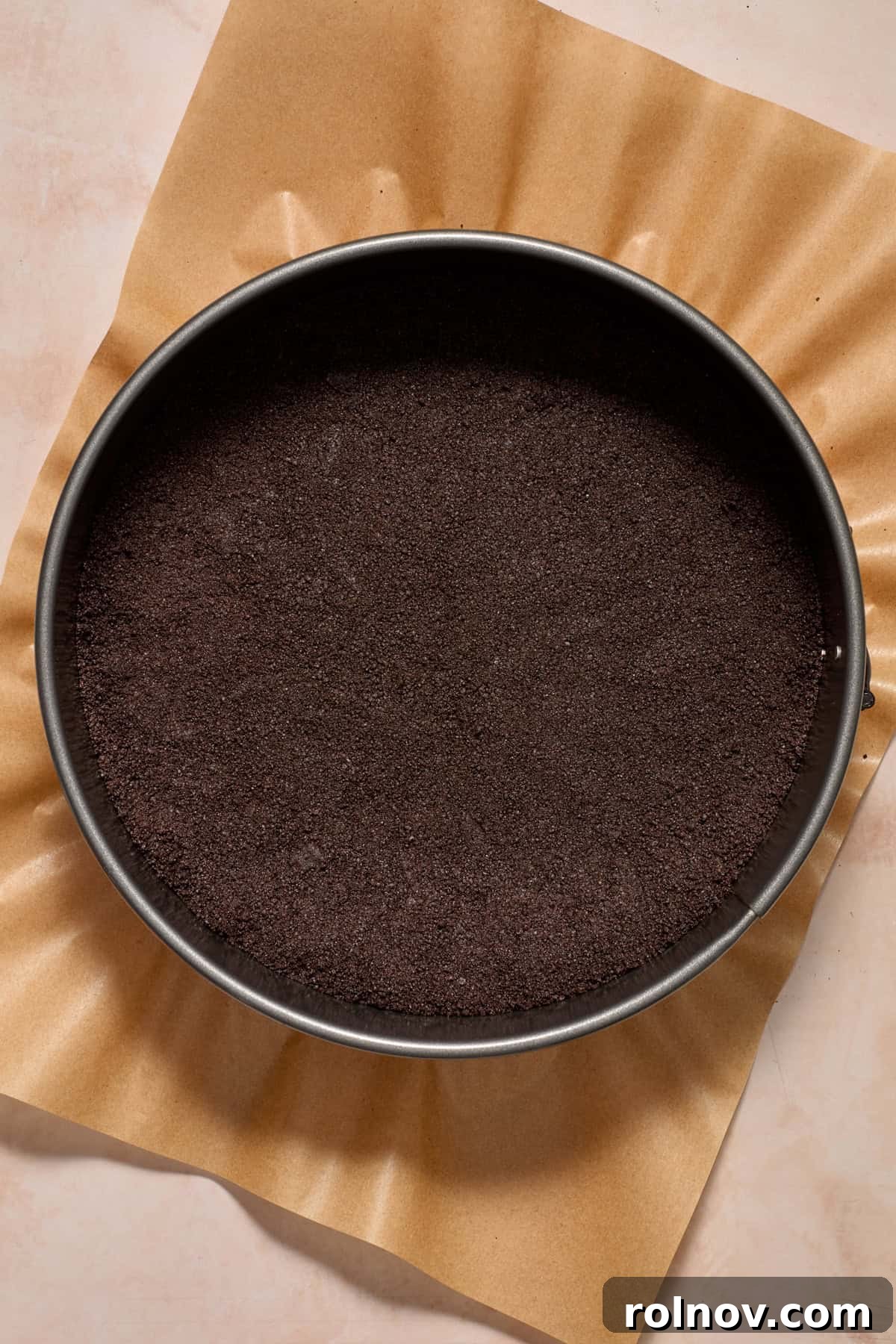 Oreo Ice Cream Pie Recipe: No-Bake Cookies and Cream Dessert 7 Springform pan with Oreo cookie crust pressed into it.