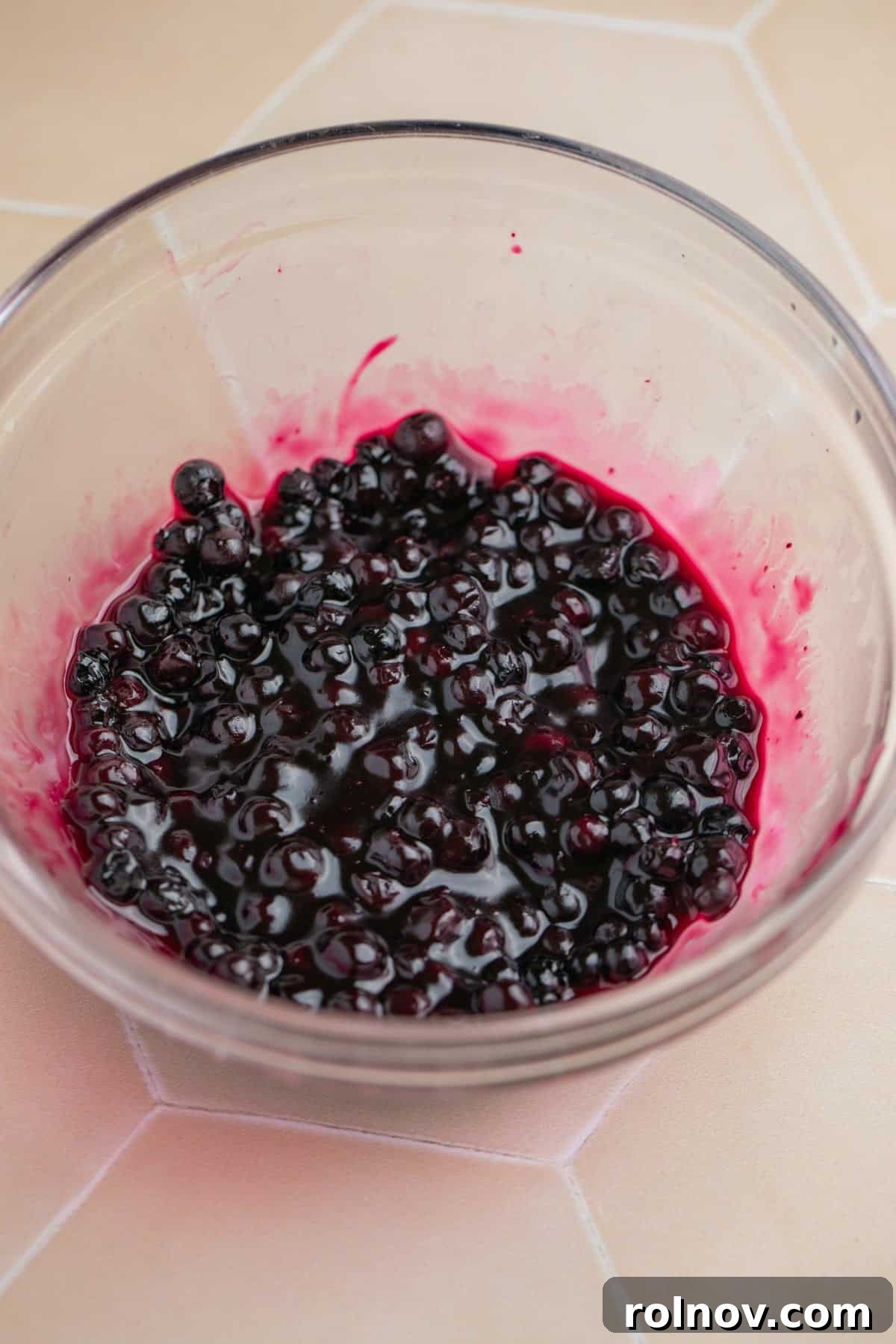 Small bowl with blueberry sauce.
