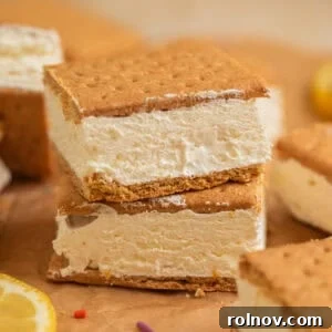 Lemonade Ice Cream Sandwich Recipe — Refreshing Citrus Treat 13 Lemonade ice cream sandwiches stacked on top of each other on parchment.