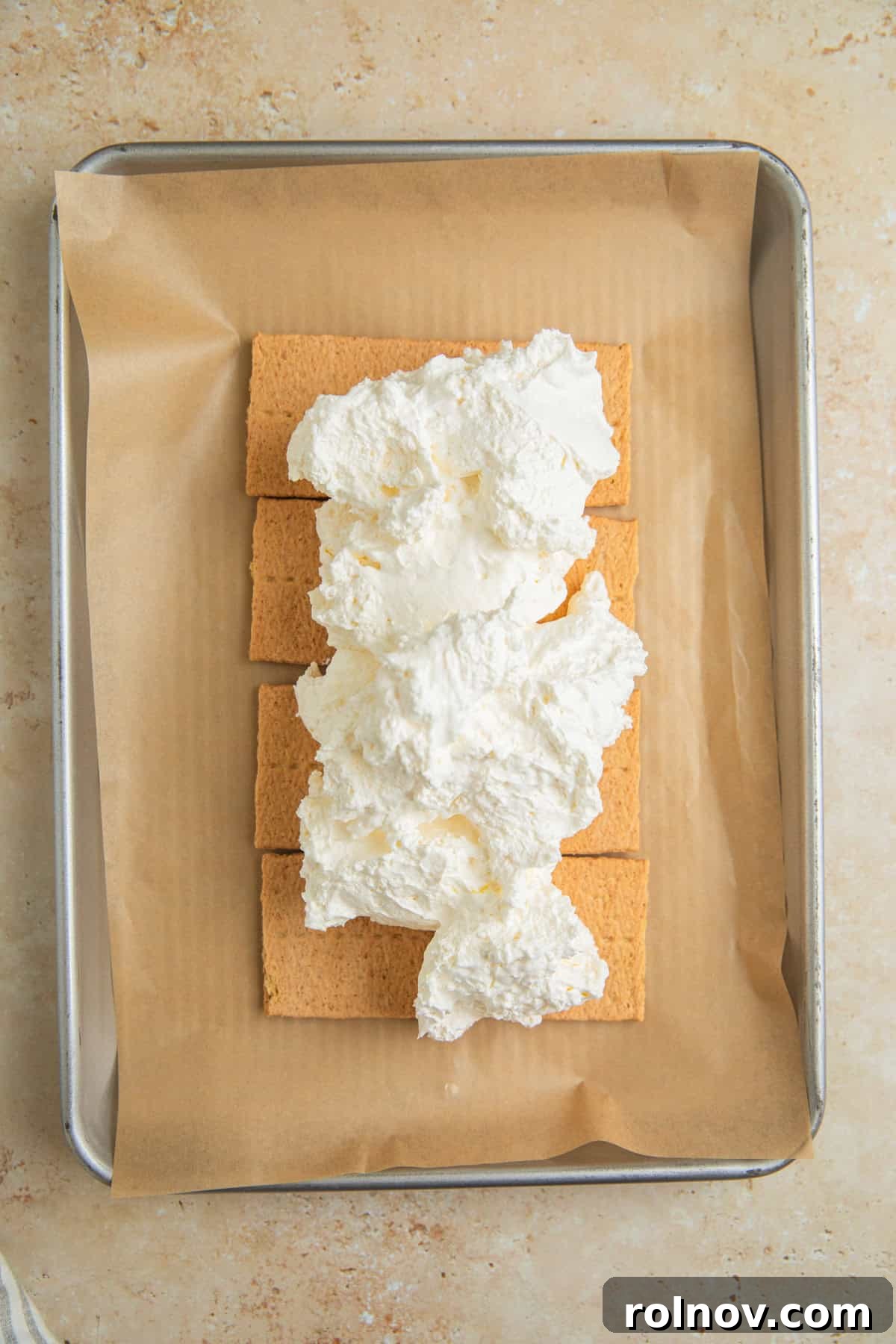Lemonade Ice Cream Sandwich Recipe — Refreshing Citrus Treat 5 Graham cracker sheets with whipped topping over top.