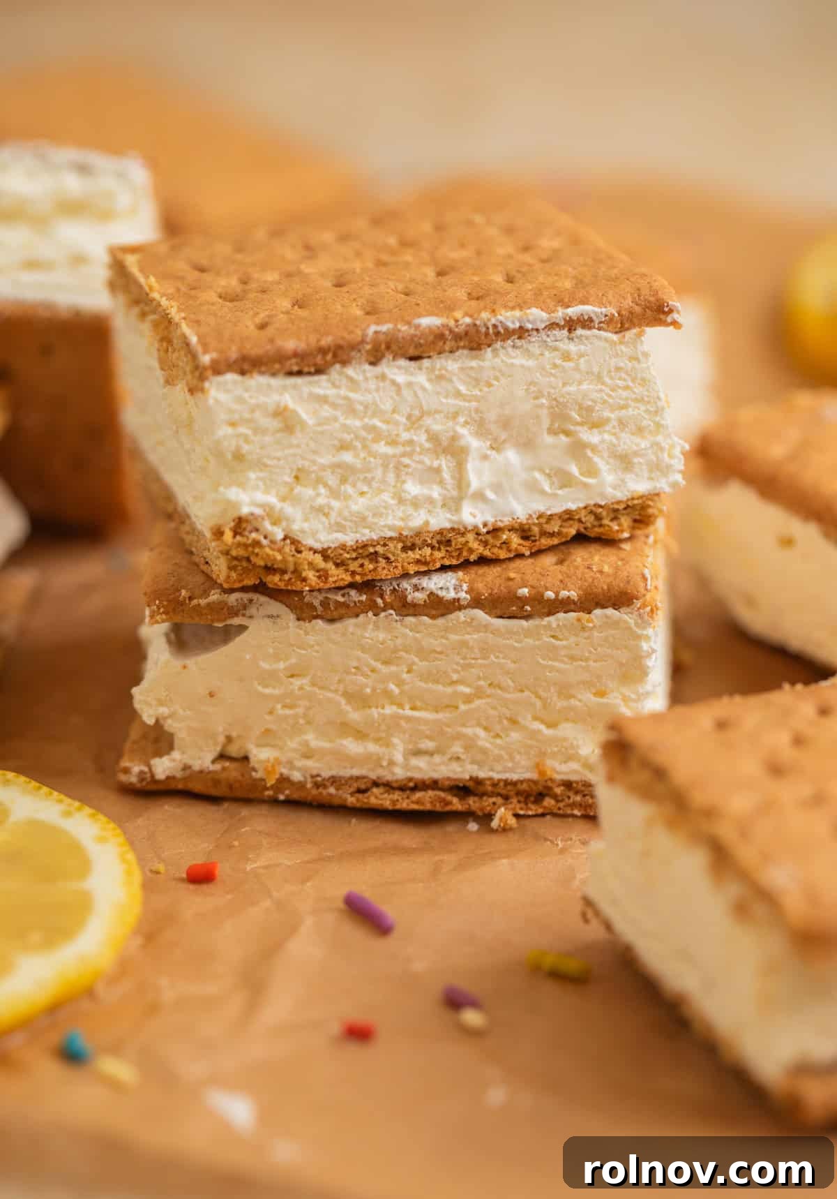 Lemonade Ice Cream Sandwich Recipe — Refreshing Citrus Treat 8 Graham cracker ice cream sandwich squares stacked on each other.