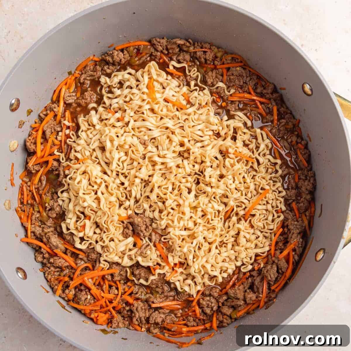 Ramen noodles softened and spread out more in pan.