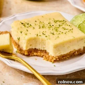 Creamy margarita bar on plate with forkful.