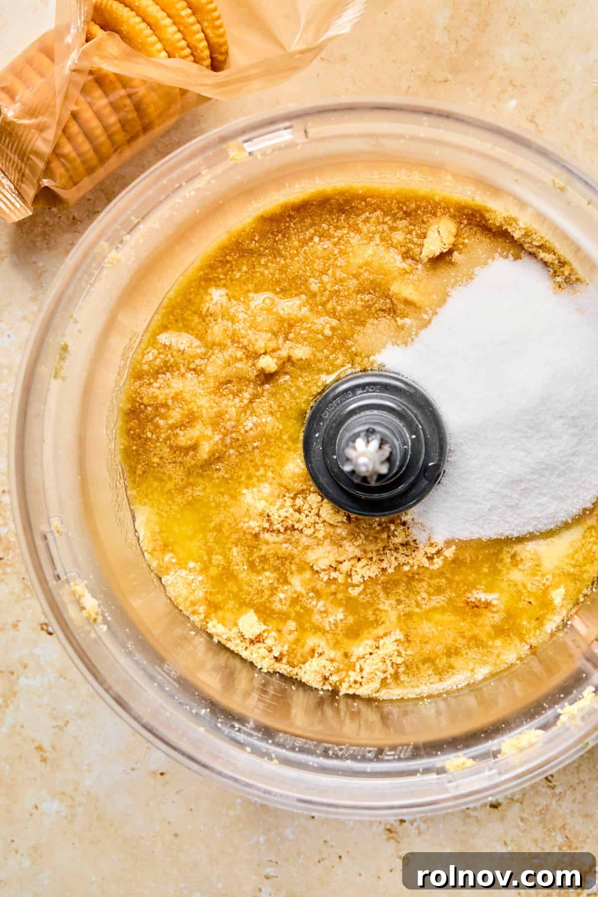 Crushed ritz crackers in food processor with sugar and butter.