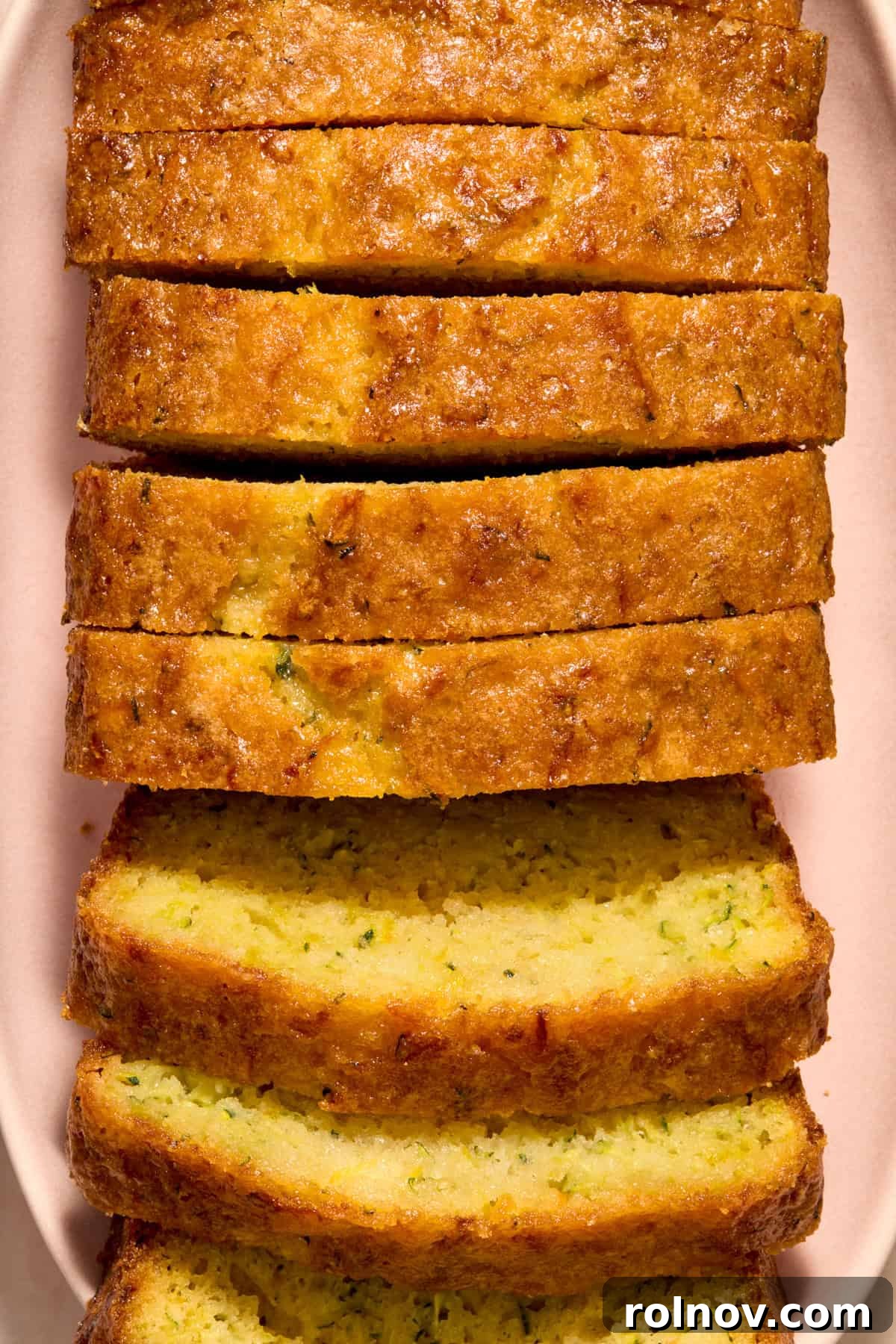 Moist Lemon Zucchini Bread with Citrus Glaze 2 Slices of lemon glazed loaf of lemon zucchini bread.